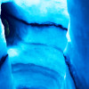 The dark stripes in the ice show you exactly how Iceland's glaciers are characterized by steady volcanic eruptions.